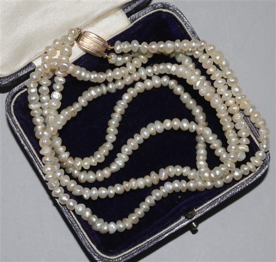 A double strand cultured baroque pearl necklace, with gold clasp, 44cm.